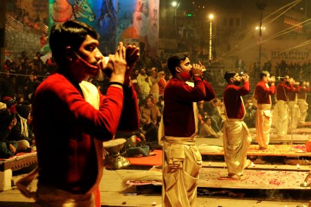 Ganga Aarti Ceremony rituals performed by Hindu priests at Assi Ghat in Varanasi.